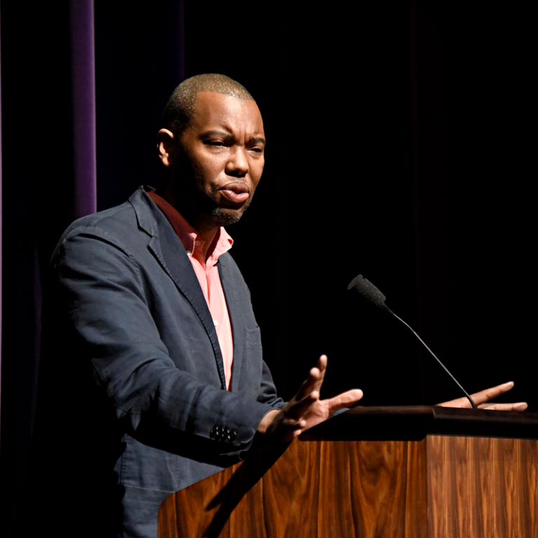 african american man speaking at podium